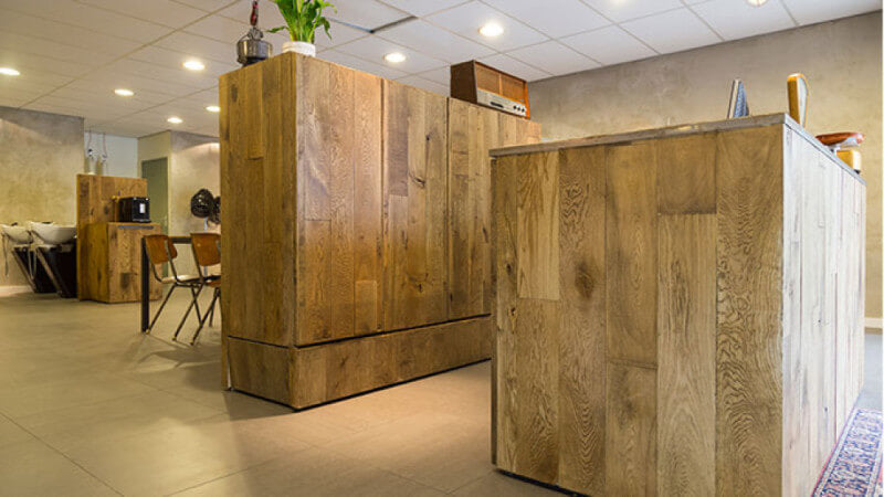 Wood barbershop counters finished in a brown wood stain.