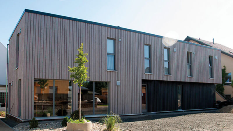 Exterior wood finish on wood paneled building.