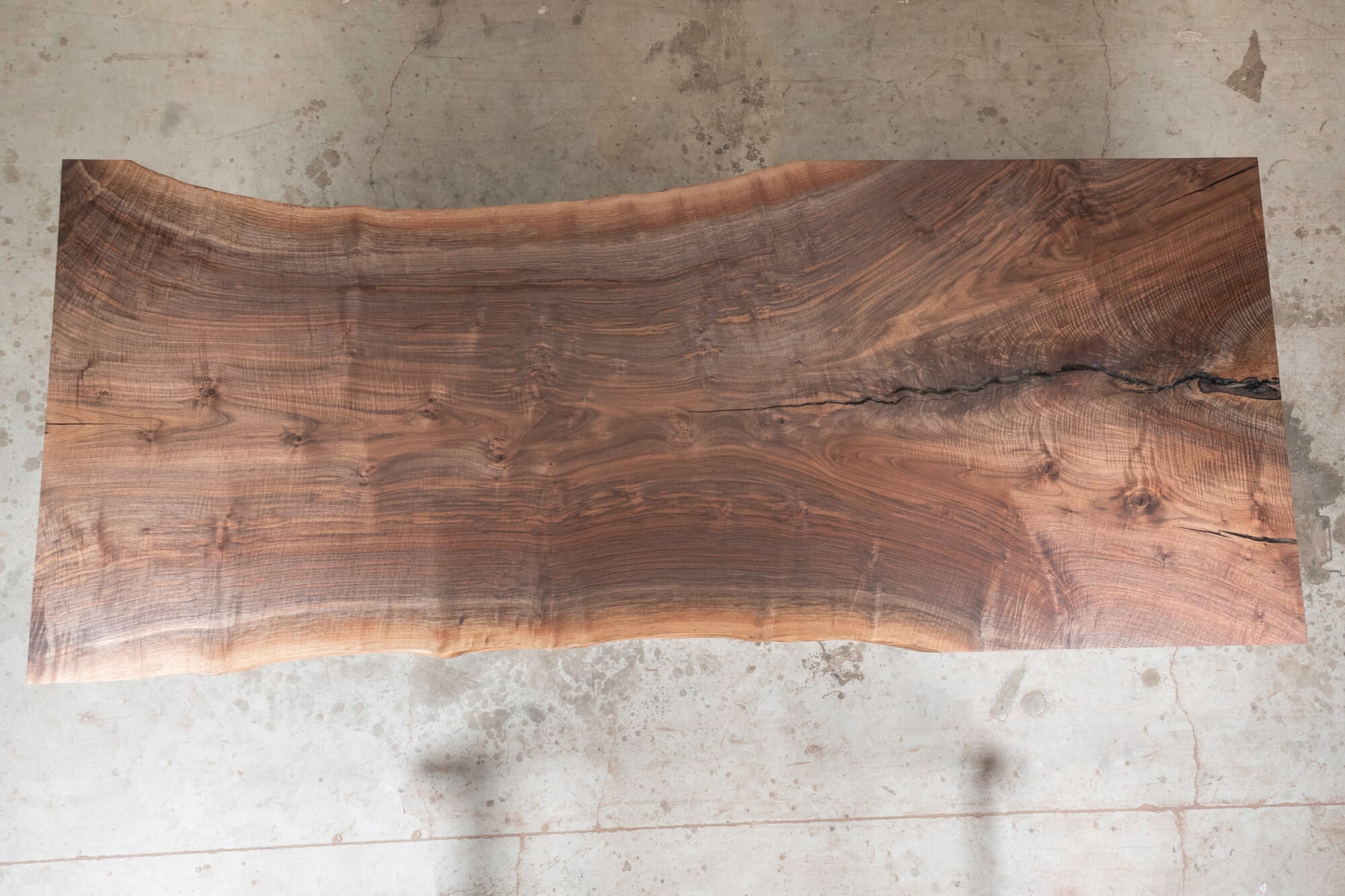 Beautiful black walnut slab table finished with Rubio Monocoat.