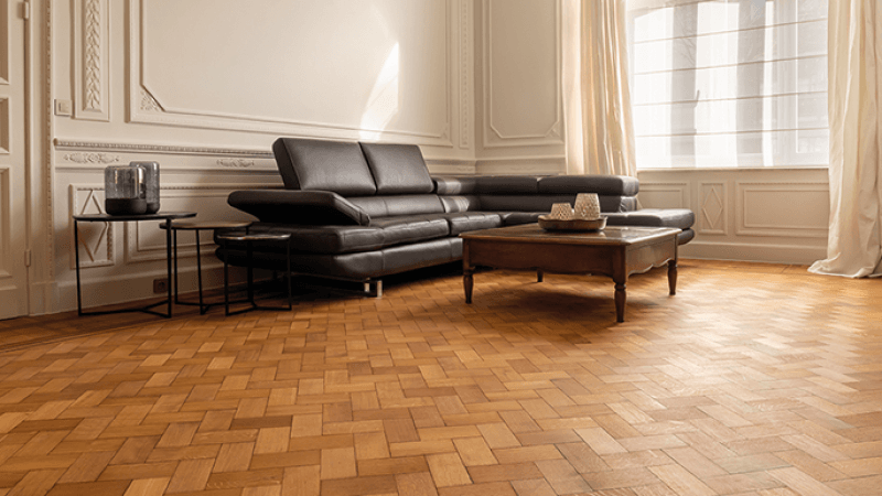 A Rubio Monocoat finished herringbone and parquet wood floor in a private home.