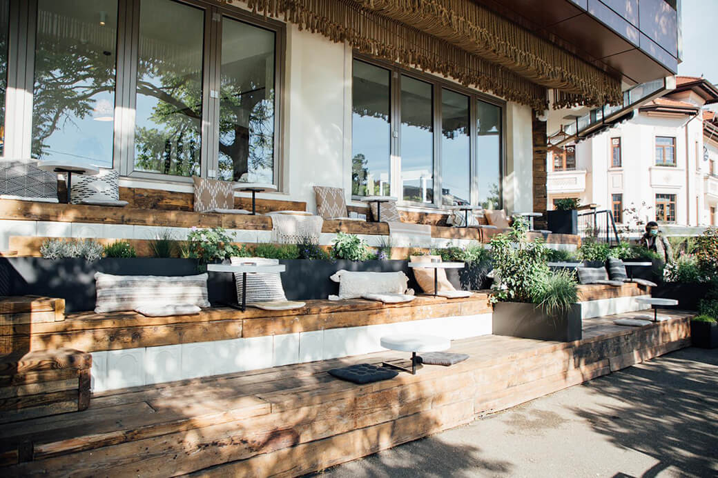 Restaurant stepped patio seating made from wood.