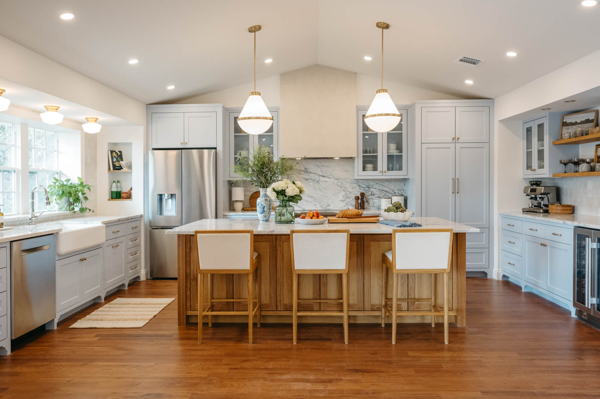 Project inspiration for a custom kitchen with a white oak island focal point finished using Rubio Monocoat Oil Plus 2C hardwax oil finish for interior wood projects. 