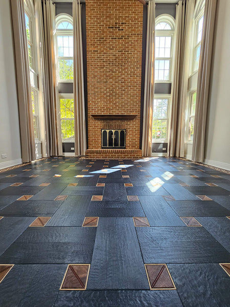 Basketweave floor pattern made from white oak, walnut, bubinga and maple woods. 