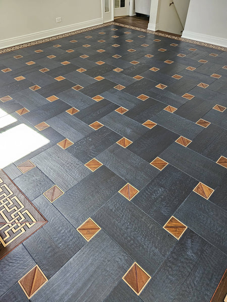 A blue-toned white oak basketweave floor with multi-species squares incorporated into the design.