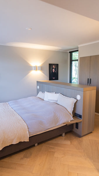 An oak bed finished with a grey hardwax oil wood finish.