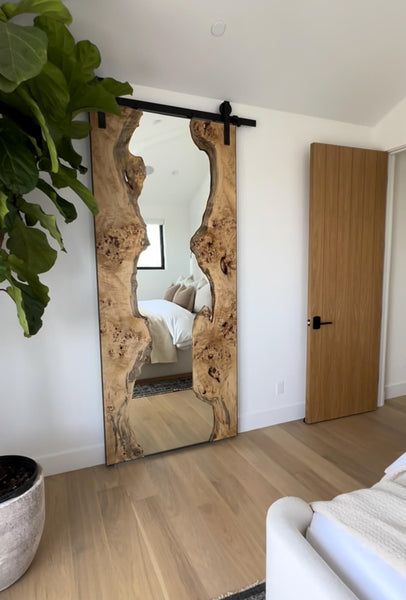 A sliding door that doubles as a mirror made from mappa burl wood and finished with Rubio Monocoat Oil Plus 2C hardwax oil wood finish.