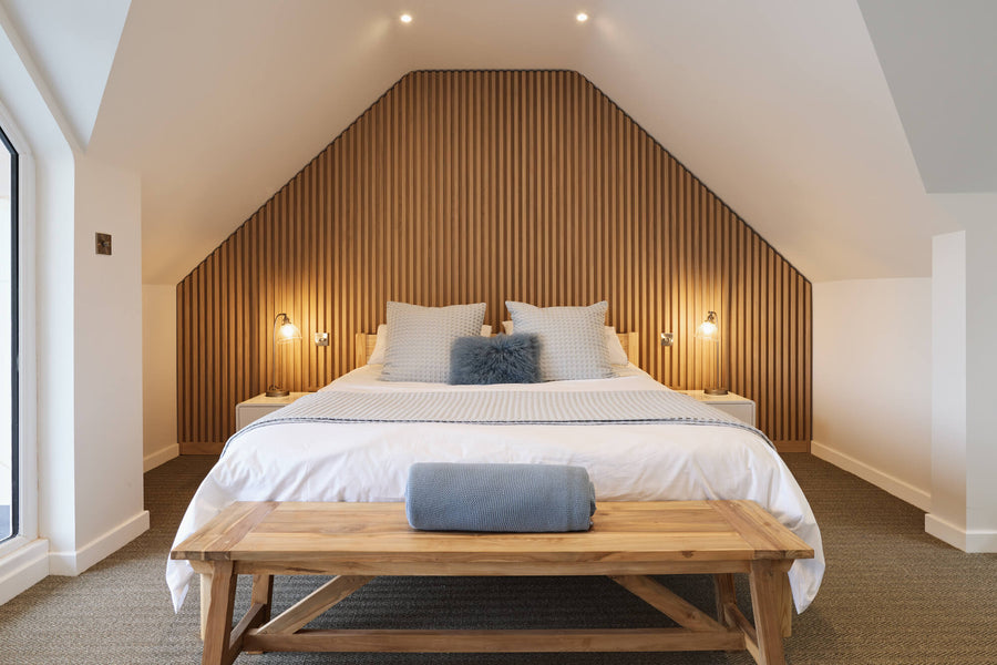 A modern accent wall featuring white oak slats finished with a hardwax oil wood finish. 