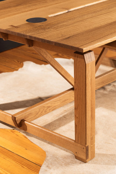 An amazing detail shot of the traditional joinery methods included in this white oak desk.