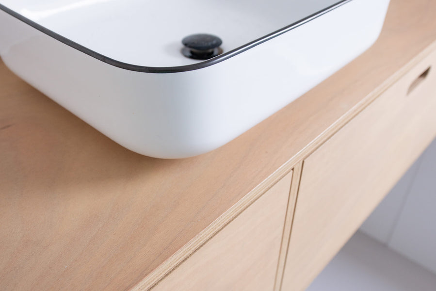 A wood bathroom vanity finished using Rubio Monocoat Oil Plus 2C hardwax oil wood finish.