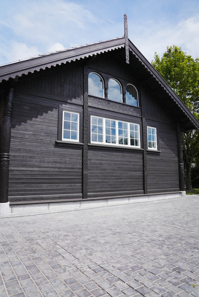 Exterior millwork of the Belgian Royal Horse stables finished using DuroGrit "Saddle Black".