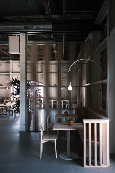 A modern barbecue restaurant with white-toned furniture made from alder.