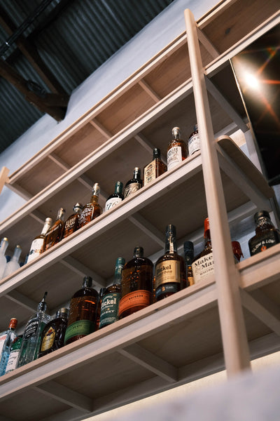 Open shelving in a bar area of a restaurant.