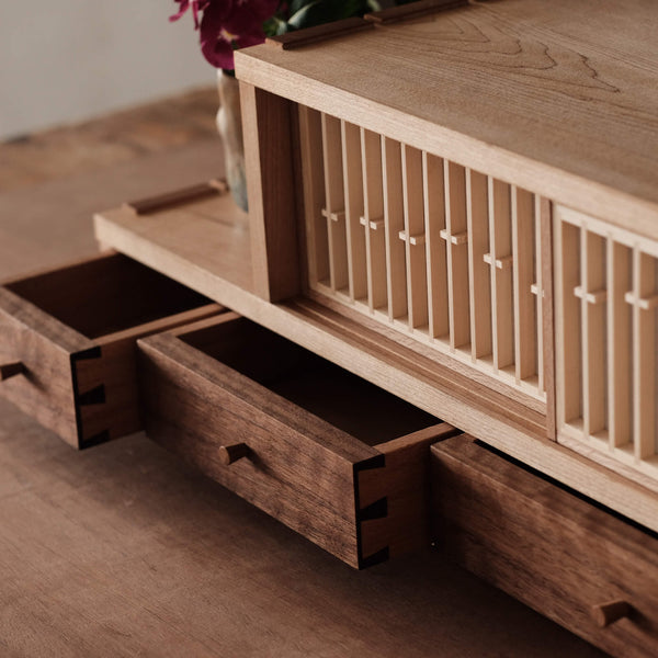 A mixed species tea cabinet that was hand crafted and finished using Oil Plus 2C wood finish.