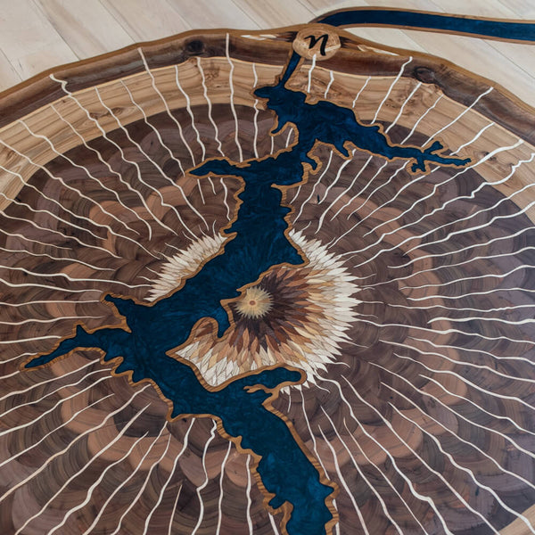 Large tree ring wood inlay with an epoxy filled crack in the center.