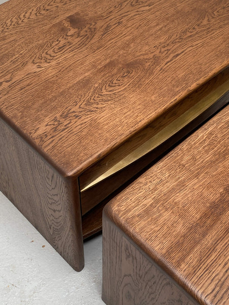 A close up on the grain of two oak nightstands featuring brass accents and finished with Rubio Monocoat Oil Plus 2C hardwax oil wood finish.