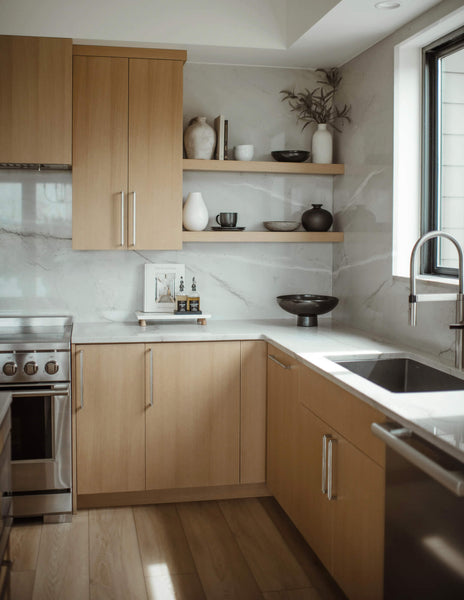 A perfectly curated white oak kitchen with modern and vintage elements blended seamlessly together.