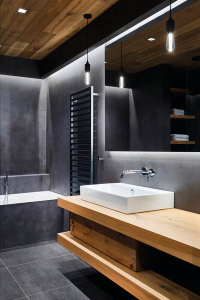 Bathroom with oak wood vanity.